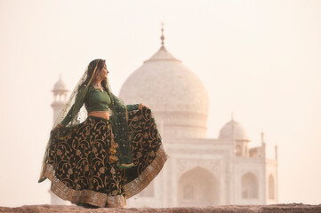 Woman in sari at Taj Mahal, India,