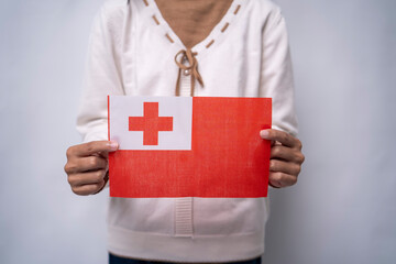 Hands Holding National Flag of Tonga