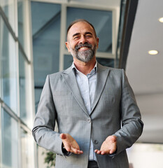 A man in a blue shirt is standing in office, businessman portrait