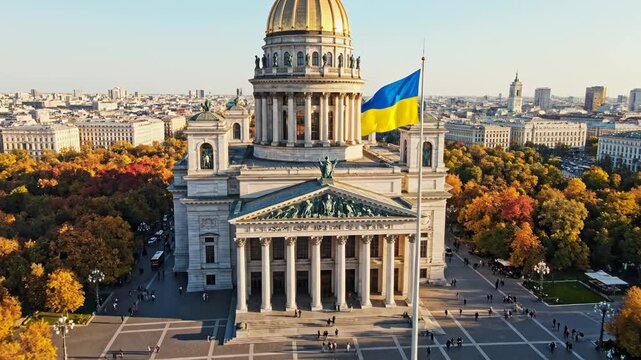 Aerial view of a grand building with a flag