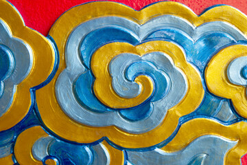 Plaster sculptures decorating the walls of temples in northern Thailand.