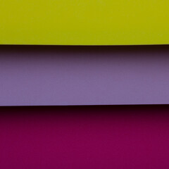 Fototapeta premium Different colors of paper stacked together in a simple arrangement on a flat surface