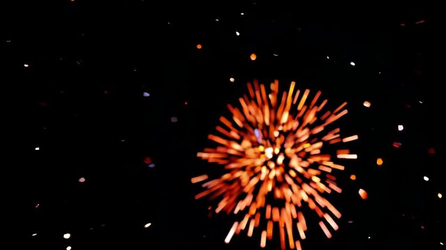 Vibrant fireworks exploding against night sky creating dazzling light patterns