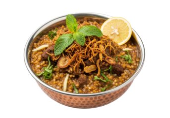spiced lentil and minced meat curry in copper bowl with lemon