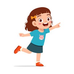 Happy cheerful Asian girl child pointing with a smile while balancing on one leg in a playful pose
