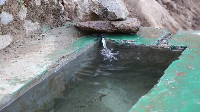Fresh water is collected in a trough for horses and animals used to carry pilgrims during the Char Dham Yatra in Kedarnath, supporting travel and animal care in Uttarakhand.
