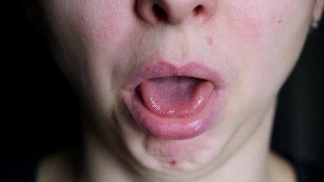 Caucasian woman, face disgust with negative emotion, nasty odor or gross smell. Person feel nauseous. Annoyed body expression and yuck reaction. Sticks tongue out of mouth. High quality 4k footage.