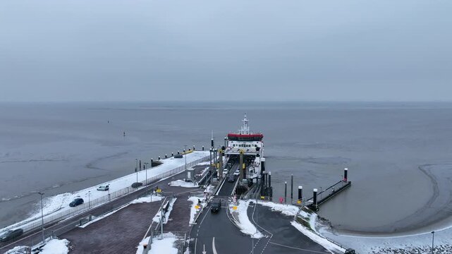 Ferry disembarking at a coastal harbor