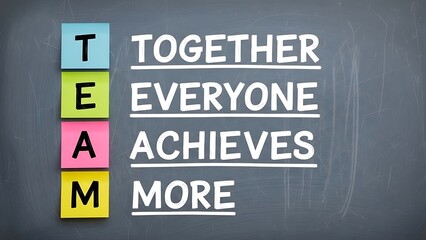 Teamwork definition spelled out using colorful sticky notes against a dark chalkboard illustrates the motivational concept that together everyone achieves more.