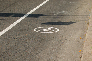 Bicycle path with painted bike lane symbol on asphalt