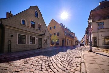 Fototapeta premium Cobbled pavements of old town streets in Klaipeda, Lithuania on sunny