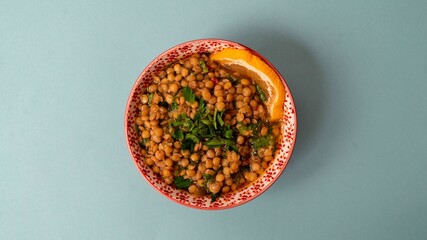 Spiced red lentils garnished with cilantro and lemon