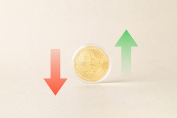 Gold Bitcoin coin centered between red down and green up arrows on a neutral background. Concept of crypto market volatility, financial trading, investment risk, and digital currency price fluctuation