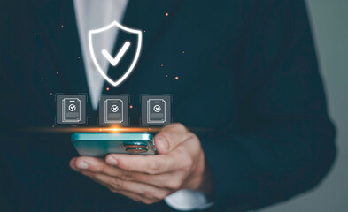 Cybersecurity and data protection. Concept of personal information security, privacy policy, firewall, and secure login for corporate network. Professional holding shield icon with padlock on mobile