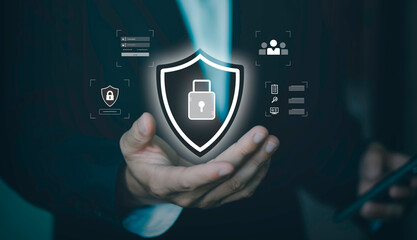 Cybersecurity and data protection. Concept of personal information security, privacy policy, firewall, and secure login for corporate network. Professional holding shield icon with padlock on mobile