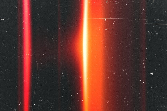 retro film overlay effect with scratch dust and light leaks.retro Cinematic grain noisy distressed texture light ray flare lens on black background.abstract grunge old film burn background