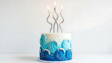 Beautiful blue wave cake with three lit candles on top
