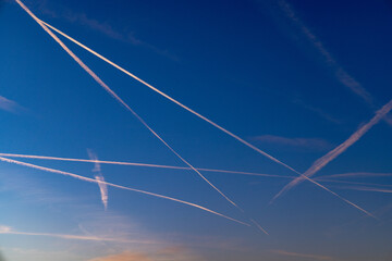 contrail of aircrafts in sunset mood