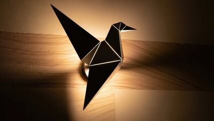Origami bird wall lamp casting warm ambient glow