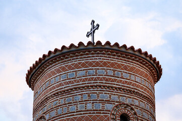 Architectural detail of the Saint Panteleimon church domes in Ohrid, featuring traditional Byzantine brickwork and stone under a dramatic sky.