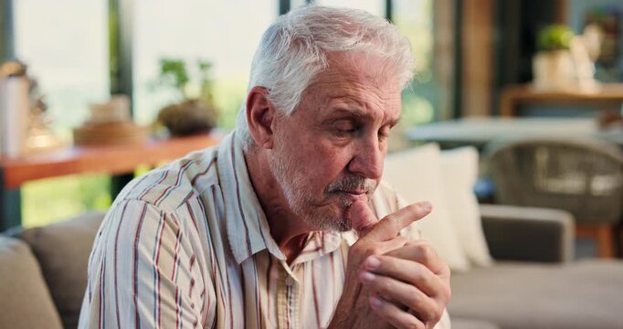 Senior man, thinking and stress on sofa in home with mental health, sad and worry in retirement. Elderly person with depression, anxiety or bad memory on couch, regret and frustrated at apartment