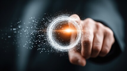 A person's hand reaching out to touch a glowing orange circle surrounded by white particles