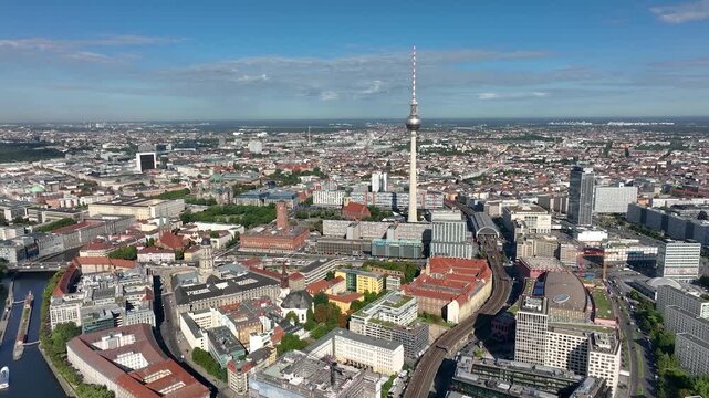 City of Berlin, Germany from above.Aerial view of cityscape showing architectural landmarks Fernsehturm TV Tower and Berlin Cathedral by day. Drone Flight over Alexanderplatz TV Tower, Sunflairs circa