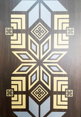 Belarusian ornament design featuring intricate patterns in yellow and blue on a rich wooden background, showcasing cultural artistry and craftsmanship in decorative elements