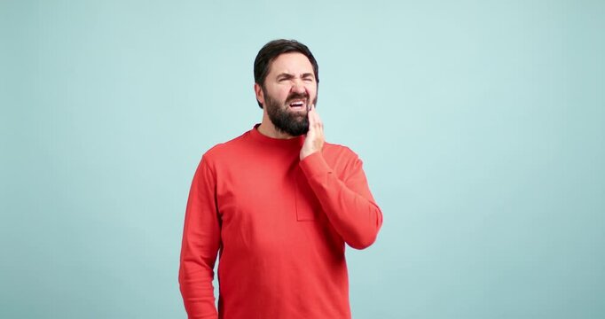 Bearded man suffering from a toothache
