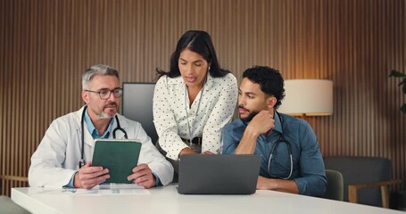 People, doctor and meeting with laptop in office for planning, finance report and medical expenses. Manager, staff and briefing with tech for healthcare funding, revenue analysis and insurance claims - Powered by Adobe