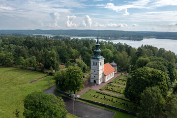 Aerial view of an old Swedish town at a lake with a white church