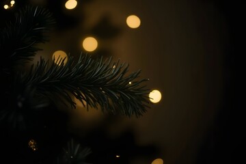 Close up of a christmas tree branch with warm lights in the background softly blurred high-quality