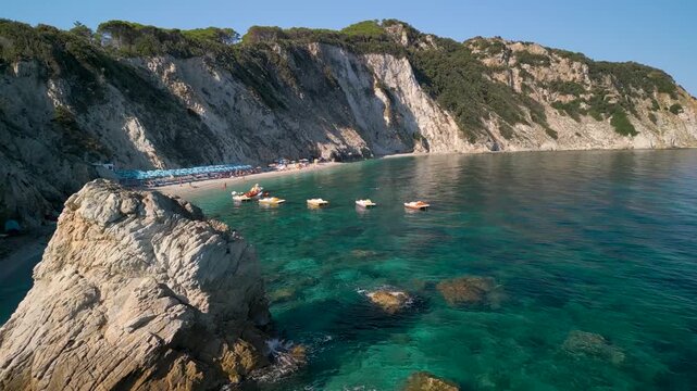 Spiaggia di Sansone Beach, Elba Island Italy &ndash; Low Flying Drone Reveal Over Rock Formation and Turquoise Sea