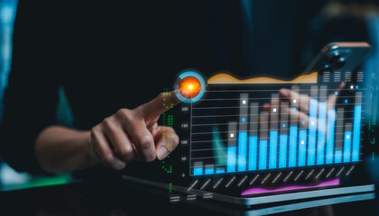 A person interacts with a digital graph displayed on a device, illustrating data trends and analytics through vibrant colors and interactive elements.