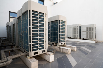 Row of air conditioning units on rooftop