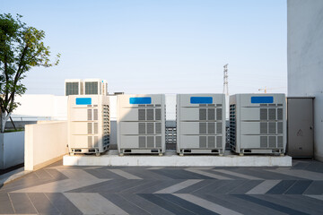 Row of air conditioning units on rooftop