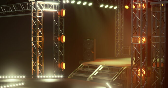 Empty backstage ramp with warm lighting truss arch metal plates cable runs and loading platform poised for set change and equipment movement