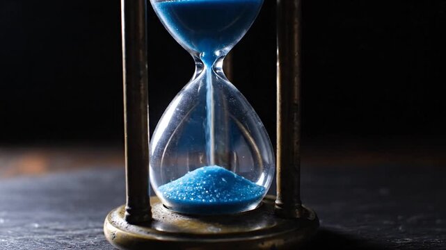 The Flow of Time Blue Sand in an Hourglass, time perception concept