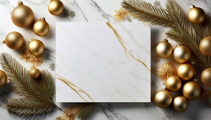 A White Piece Of Paper Sits On A Marble Countertop With A Bunch Of Gold Christmas Ornaments Surrounding It