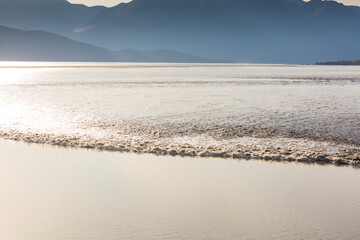 View from above of the Turnagain Arm Tidal Bore, a rolling wave of water which surges into the inlet twice a day, a natural phenomenon.
