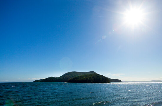 Island on Puget Sound offshore, the outline viewed from the shore.