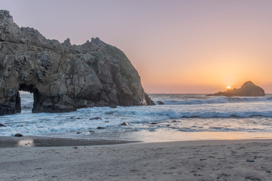 Julia Pfeiffer Burns State Park, view of the rock arch and headland at sunset.