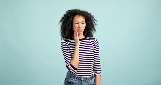 Young african american woman suffering from severe toothache