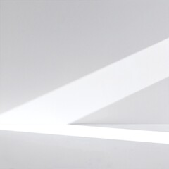 A bright white wall softly illuminated by warm sunlight streaming through a nearby window, creating gentle shadows and a serene atmosphere.