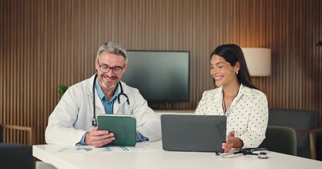 People, doctor and meeting with tech in office for planning, finance report and medical expenses. Manager, team and briefing with tablet for healthcare funding, revenue analysis and insurance claims - Powered by Adobe