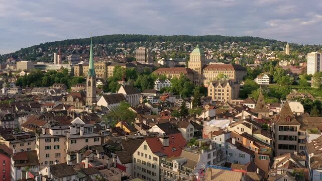 Zurich, Switzerland: Aerial drone footage of Zurich old town with the historic building of the Zurich university and other churches bell towers in Switzerland largest city. 