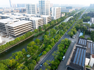 road through modern city with tree around