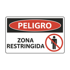 restricted area warning sign with spanish text