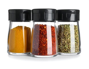 Three Spice Jars Filled with Colorful Seasonings on White.