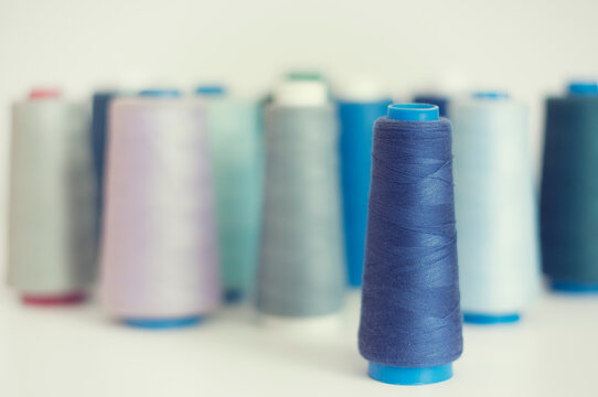 Close-up of assorted multi coloured Reels of Cotton on a table
